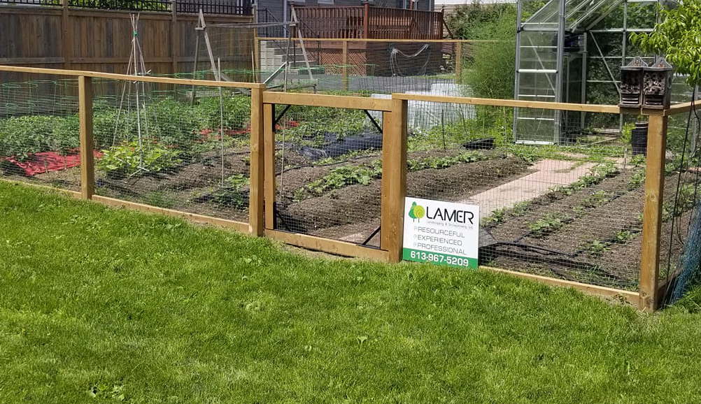 Fenced garden bed on a property