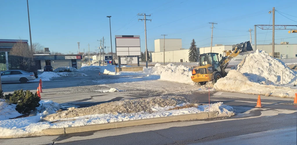 Snow cleared and stacked in a commercial parking lot