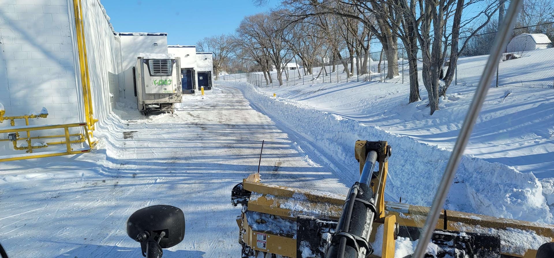 Plow clearing snow in winter