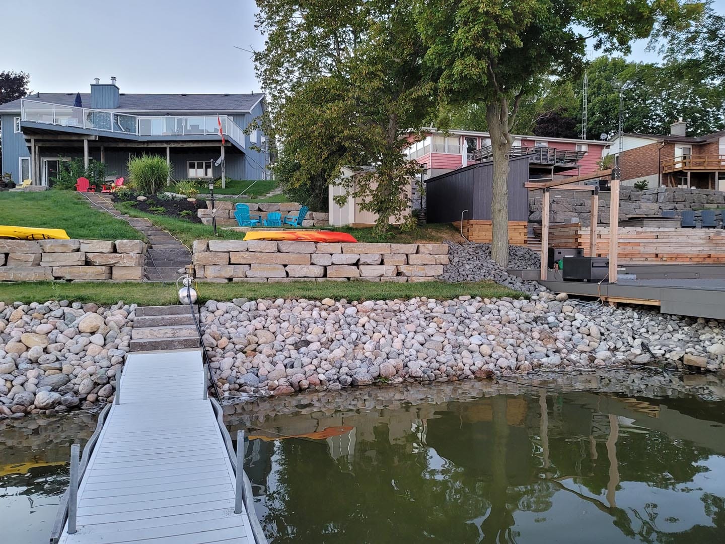 Armour stone shoreline and dock on a waterfront property