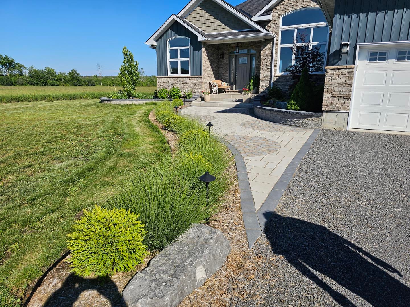 Walkway and driveway edge with new lawn