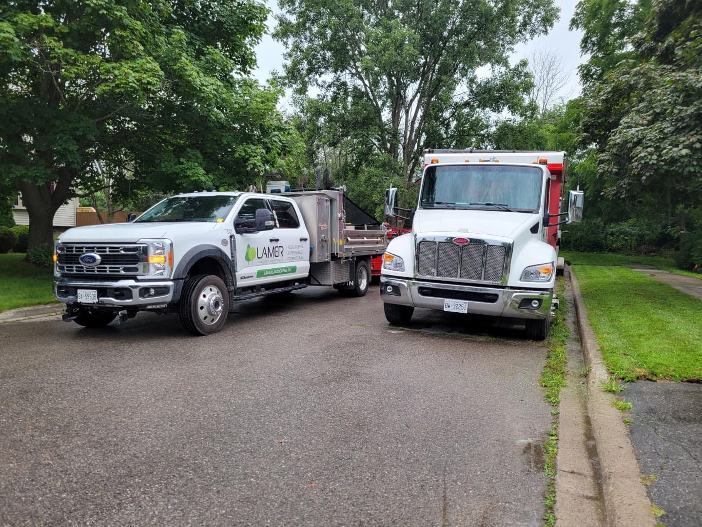 Lamer Landscaping service truck and dump truck ready for a commercial job