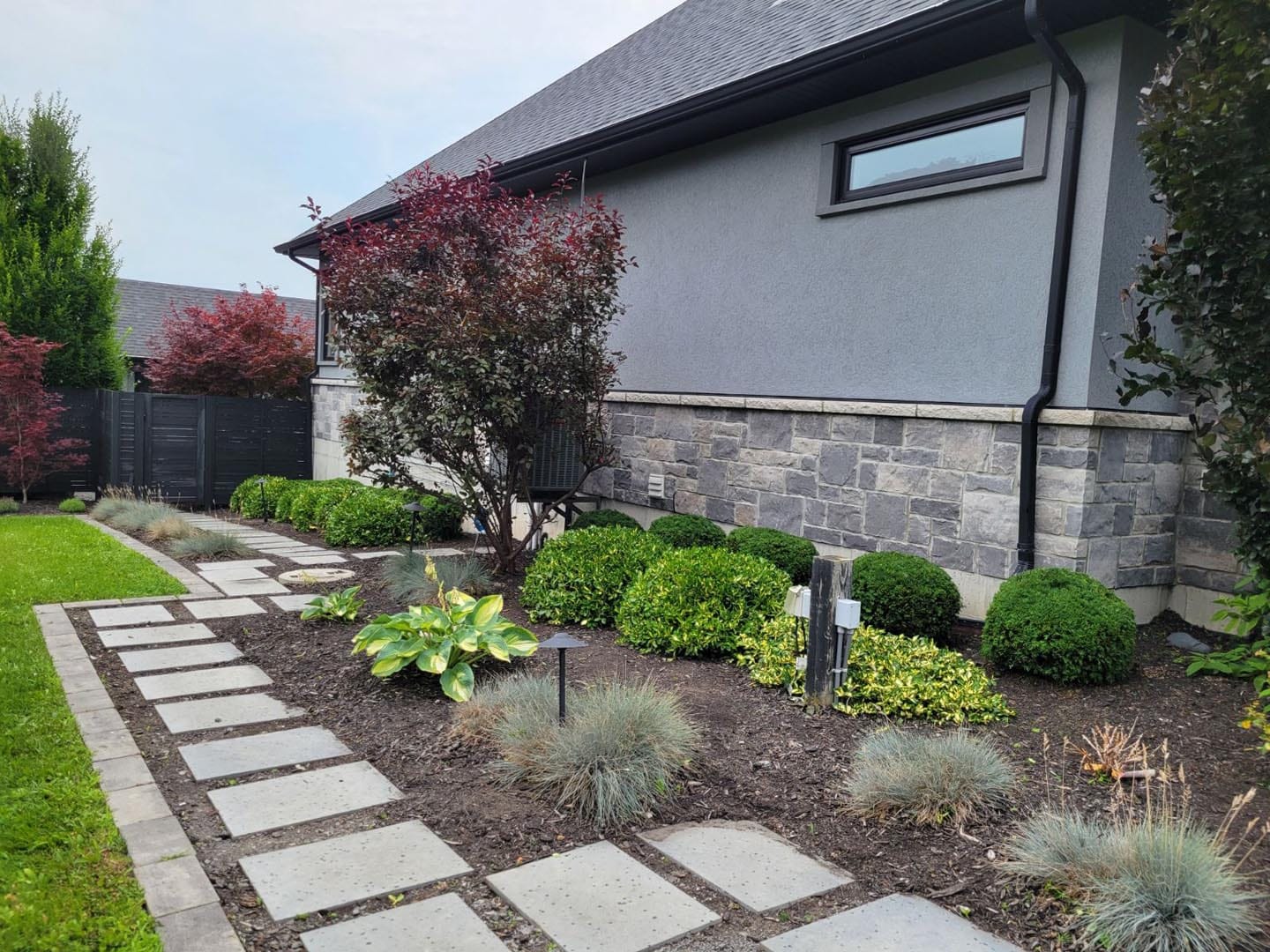 Front garden beds with shrubs and perennials