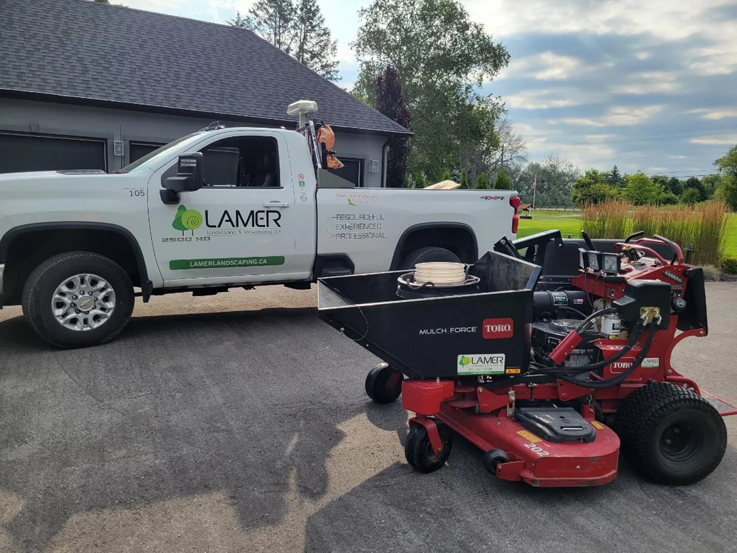 Lamer pickup truck loaded with a stand-on mower