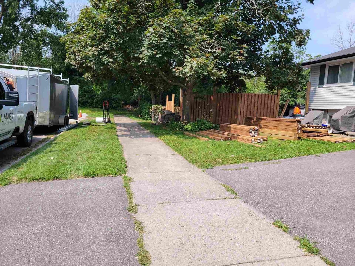 Wood privacy fence beside a newly built walkway