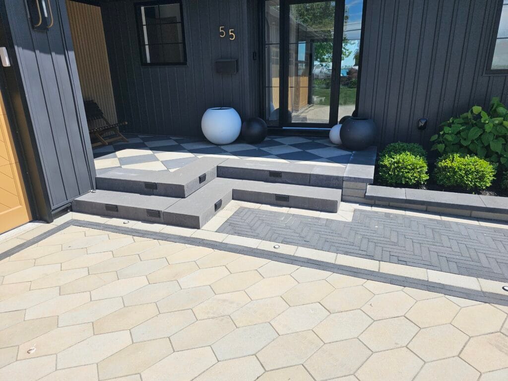 Concrete block retaining wall and steps with planted beds